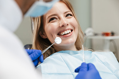 Woman in dental chair getting cosmetic dentistry.