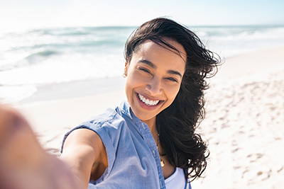 Woman on the beach with a beautiful smile