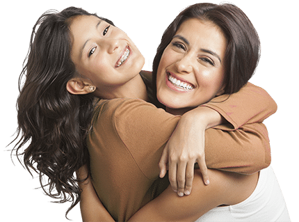 Mother with clear aligners hugging daughter with braces